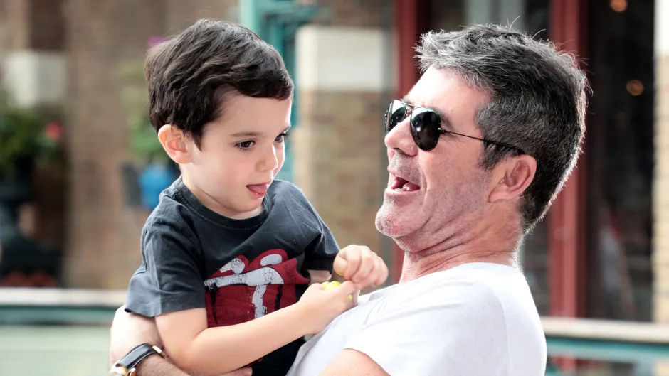 alt="Eric Cowell attending a public event with Simon Cowell"