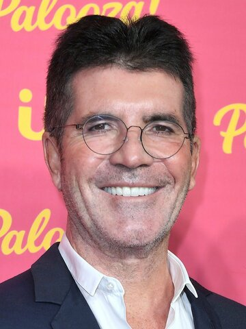 alt="Simon Cowell with partner Lauren Silverman and their son Eric"