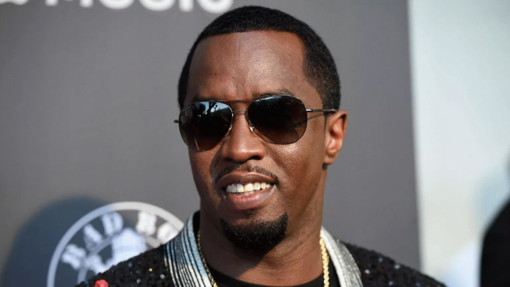 alt="Sean Combs posing with Ciroc vodka"