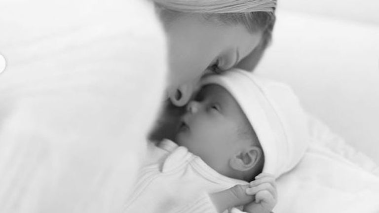 alt="Paris Hilton, her son Phoenix Barron, and husband Carter Reum"