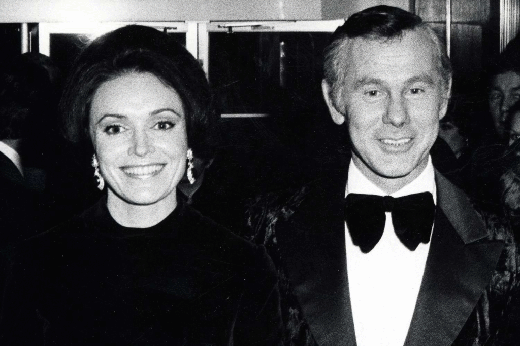 alt="Alexis Maas with Johnny Carson at a red carpet event"