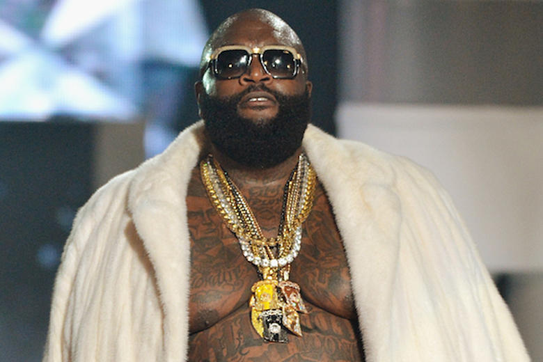 Rick Ross posing in front of mansion - Rick Ross net worth lifestyle